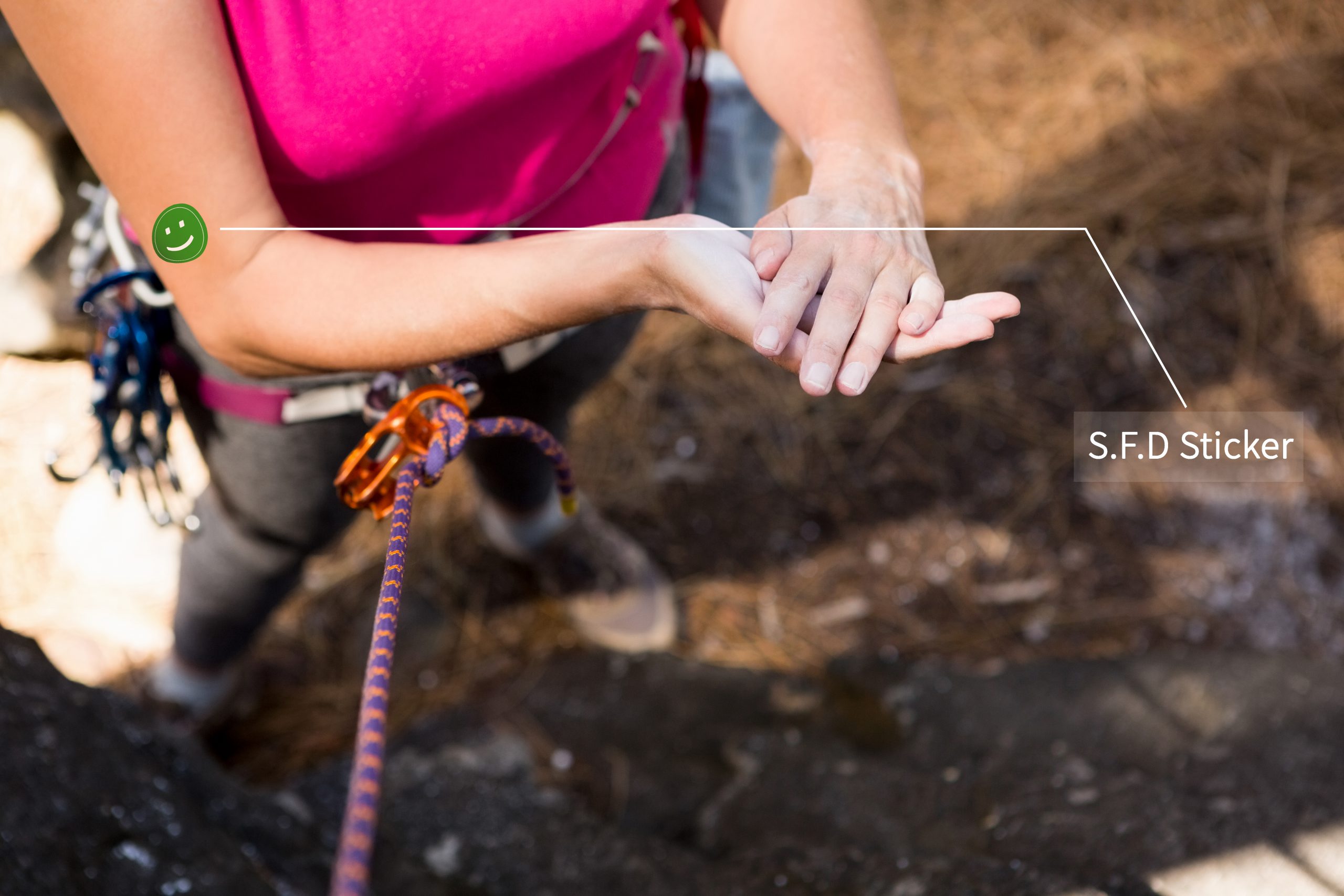 Woman getting ready to rock climbing on the nature